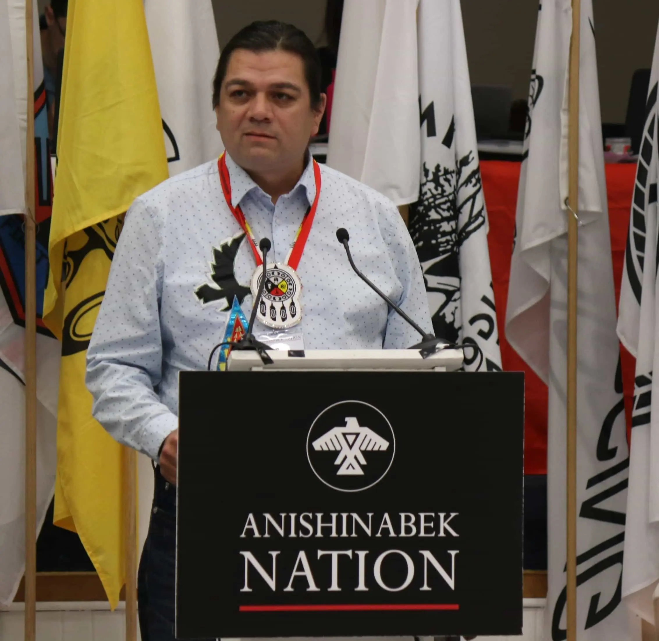 Children’s Commissioner Duke Peltier at the podium.